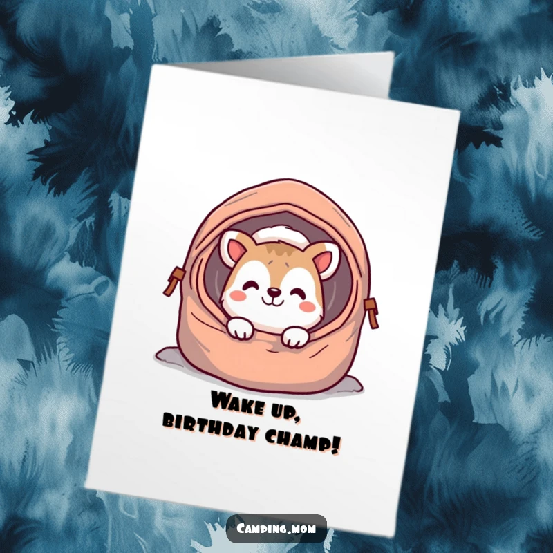 Funny Free Printable Birthday Card: cheerful camping animal character grinning from a cozy sleeping bag, ready for birthday fun.