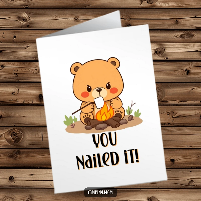 Funny Free Printable Congrats Card: Mama bear with determined look roasts a marshmallow over a campfire, celebrating success.