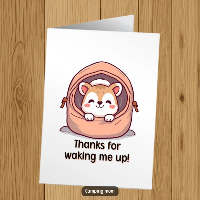 Funny Free Printable Thank You Card: a cheerful camping animal character peeking from a sleeping bag, offering a grateful grin.