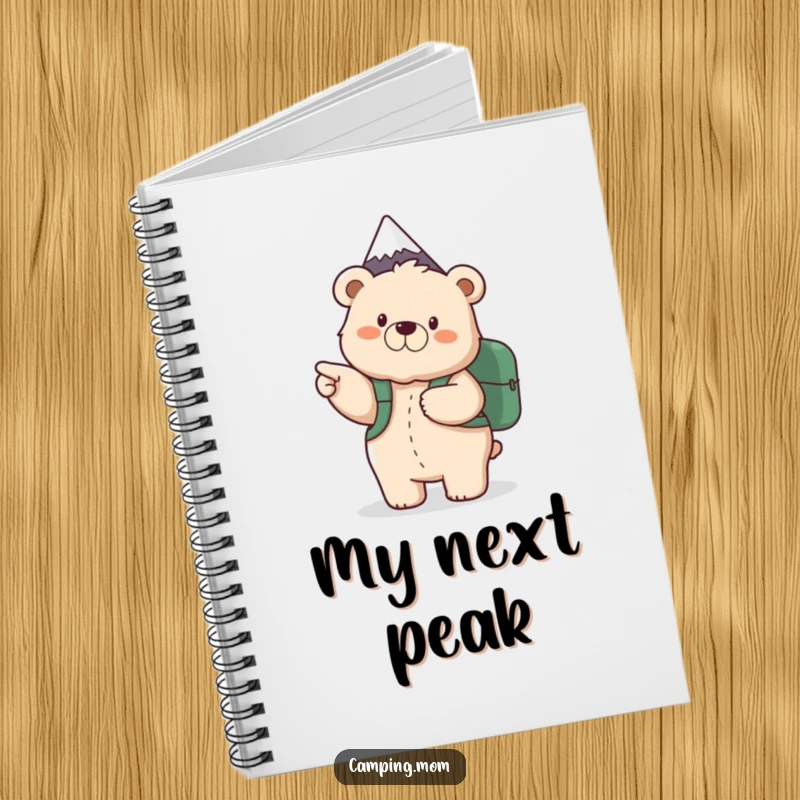 Funny notebook with a fluffy mama bear and backpack, pointing excitedly to a mountain peak, perfect for adventure planning.