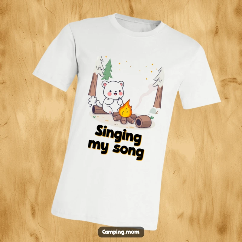 Funny Kawaii Camping Animal T-Shirt showing a happy creature serenading a bright campfire. Perfect for music and nature fans.