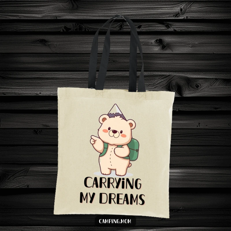 Funny tote bag featuring a fluffy mama bear with a backpack, excitedly pointing the way to a mountain peak for outdoor trips.